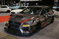 BLITZ RACING PROJECT WRX. Di kelas Tuning Car yang menjadi rajanya adalah mobil Subaru WRX garapan Blitz. Berbagai perubahan disemua sisi jelas terlihat, terutama pada tampilan eksterior. Seluruh eksterior Subaru WRX ini diubah dengan guyuran krom, bahkan lalat pun bisa melihat dirinya sendiri seolah bercermin. Pool/dok Tokyo Auto Salon.