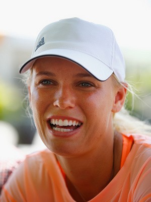 Wozniacki Melenggang Mudah