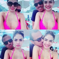 Mengenakan bikini shocking pink, Niki mesra selfie dengan sang kekasih. (Instagram/Nikita Mirzani)