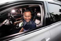 Dahlan meninggalkan Kejaksaan Agung.