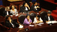 Pemohon mendengarkan putusan yang dibacakan Ketua MK Arief Hidayat.