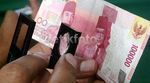 Begini Cara Membedakan Uang Asli dan Palsu