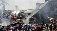 Asap mengepul dari lokasi jatuhnya pesawat. Atas/AFP/detikFoto.