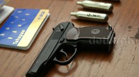 Polisi juga menyita sepucuk senjata api dan pelurunya.