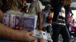 Penjual Uang Receh Sasar Pemudik