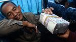 Penjual Uang Receh Sasar Pemudik