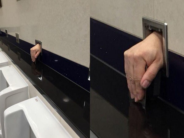 Tangan Misterius Muncul di Dinding Toilet Bandara Hong Kong