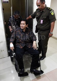 Udar meninggalkan Pengadilan Tipikor.