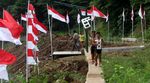Bendera Merah Putih Dikibarkan di Kali Ciliwung