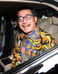 Menteri Agraria dan Tata Ruang Ferry Mursyidan Baldan langsung naik ke mobil dinasnya usai bertemu pimpinan KPK. Pool/Lamhot Aritonang/detikFoto.
