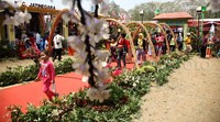 Pengunjung melintas di depan stand peserta Festival Lebaran Betawi VIII.