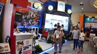 Pengunjung melintas di depan stand NTMC Polri. Pool/Aris Ganjar/detikFoto.