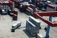 Truk kontainer keluar dari dermaga peti kemas ekspor impor  milik PT Pelabuhan Indonesia II.