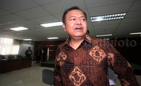 Rio meninggalkan Pengadilan Tipikor usai menjalani sidang perdana.