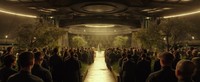 Momen itu terjadi di pernikahan Finnick (Sam Claflin) dan Annie Cresta (Stef Dawson). Katniss duduk di samping Joanna yang tampil botak setelah disiksa oleh Capitol. (Dok Lionsgate)