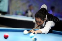 Emilia Putri Rahmanda dari Jawa Timur tampak serius berlaga di final Kejurnaas Biliar Junior 2015. Dalam kejuaraan ini Emilia berhasil mengalahkan Anita Arviani dari Kalimantan Barat dengan skor 6-4.