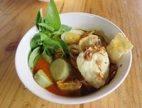 Ada di jalan Kh. Sholeh Ali Anda bisa menyantap semangkuk laksa hangat berkuah ebi yang komplet. Mantap!