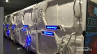 Kapsul dengan jenis beta, dengan pintu didorong ke samping Kapsul dengan jenis beta, dengan pintu didorong ke samping