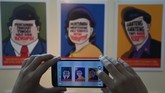“Ganteng-ganteng tapi anak koruptor,” demikian bunyi tulisan yang menyertai salah satu seni grafis yang dipamerkan di TIM. Para seniman yang kebanyakan anak muda ini banyak mengambil tema perseteruan KPK dengan Polri. (ANTARA FOTO/Hafidz Mubarak A./Rei/mes/15)