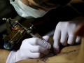 Melacurkan Kulit demi Serentang Tato