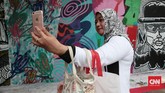 Acara Urban Off the Wall yang digelar di dinding IFI, Museum Nasional, D'Gallerie, dan Yello Hotel itu memang bertujuan memperkenalkan seni jalanan ke ranah lebih luas. (CNN Indonesia/Andry Novelino)