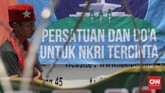 Sebelum meminta massa bubar, Rizieq meminta besok agar kembali digelar unjuk rasa di depan Polda terkait dengan adanya pemeriksaan anggota Gerakan Nasional Pengawal Fatwa MUI. (CNN Indonesia/Safir Makki)