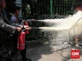 Polda Metro Selidiki Aksi Buruh Bakar Karangan Bunga Ahok