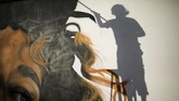 POW! WOW! Israel diadakan untuk berkontribusi, berbagi budaya dan keindahan melalui seni. Komunitas artis itu terbang ke Arad yang dianggap belum tersentuh seni jalanan. (REUTERS/Amir Cohen)