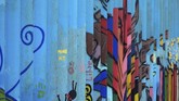 Salah satu seniman yang terlibat adalah Enrique Chiu. Chiu telah membuat mural di perbatasan AS-Meksiko selama tujuh bulan terakhir sepanjang dua kilometer. (AFP PHOTO / GUILLERMO ARIAS)