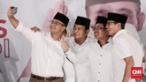 Anies Baswedan dan Sandiaga Uno di Kantor DPP Partai Gerindra, Ragunan, Jakarta Selatan, Rabu, 15 Februari 2017, ketika menyaksikan hasil hitung cepat Pilkada DKI bersama Ketua Umum Partai Gerindra Prabowo Subianto. (CNN Indonesia/Andry Novelino)