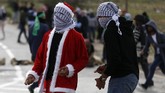 Sementara itu, ketegangan di Tepi Barat dan Jalur Gaza meningkat tajam, demonstrasi berlangsung terus-menerus. (AFP/Abbas Momani)