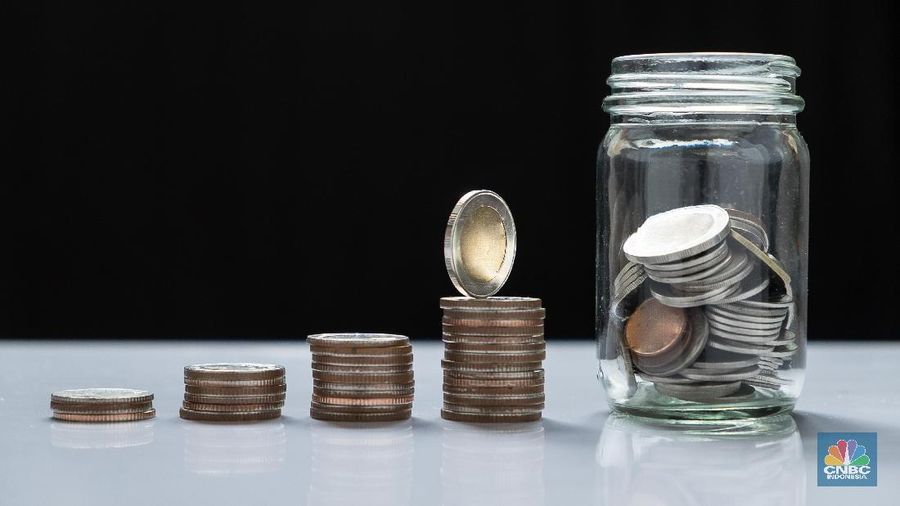 coin piles and glass for investment in the future.