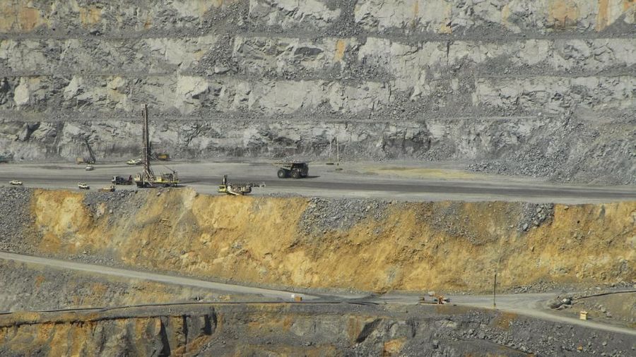 FILE PHOTO: Mining equipment is seen inside the vast open pit of the Batu Hijau copper and gold mine, run by Newmont Mining Corp, on Indonesia's Sumbawa island, in this September 21, 2012 file photo.   REUTERS/Neil Chatterjee/File Photo