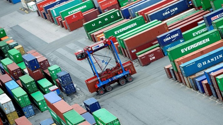 FILE PHOTO: A van carrier transports a container at the container terminal 
