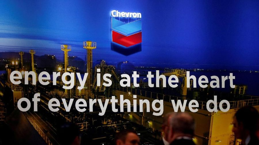 FILE PHOTO: The logo of Chevron Corp is seen in its booth at Gastech, the world's biggest expo for the gas industry, in Chiba, Japan April 4, 2017.    REUTERS/Toru Hanai/File Photo                              GLOBAL BUSINESS WEEK AHEAD        SEARCH GLOBAL BUSINESS 29 JAN FOR ALL IMAGES