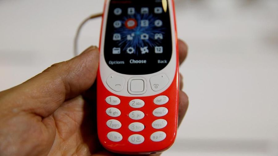 FILE PHOTO: A Nokia 3310 device is displayed at Mobile World Congress in Barcelona, Spain, February 27, 2017. REUTERS/Paul Hanna/File Photo GLOBAL BUSINESS WEEK AHEAD SEARCH GLOBAL BUSINESS 29 JAN FOR ALL IMAGES