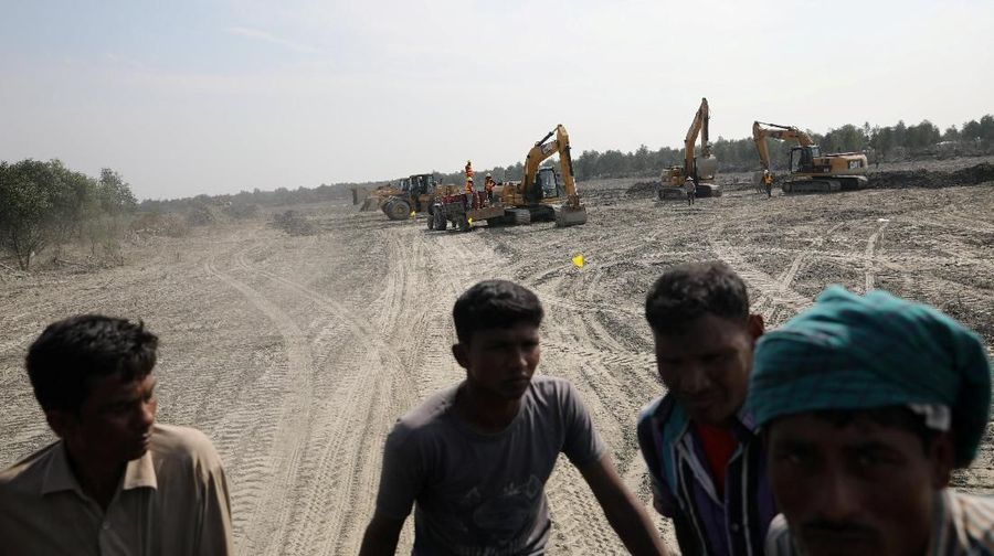 REFILE - CORRECTING ISLAND SPELLING Excavators are seen on the island of Bhasan Char in the Bay of Bengal, Bangladesh February 14, 2018. Picture taken February 14, 2018. REUTERS/Stringer