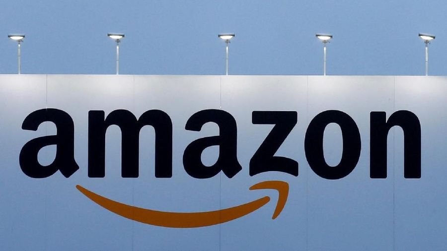 FILE PHOTO: The logo of Amazon is seen at the company logistics center in Lauwin-Planque, northern France on February 20, 2017.  REUTERS/Pascal Rossignol/File Photo