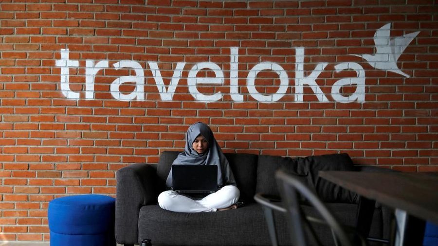 FILE PHOTO: An employee of Traveloka works at the company's headquarters in Jakarta, Indonesia, August 2, 2017. REUTERS/Beawiharta