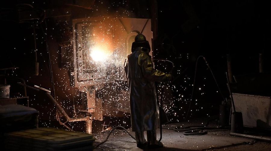 A worker of German steel manufacturer Salzgitter AG stands in front of a furnace at a plant in Salzgitter, Germany, March 1, 2018. REUTERS/Fabian Bimmer