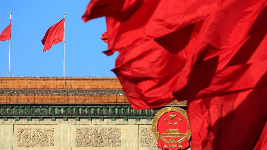 Red flags flutter outside the Great Hall of the People before the second plenary session of the Chinese People's Political Consultative Conference (CPPCC) in Beijing, China March 8, 2018. REUTERS/Aly Song