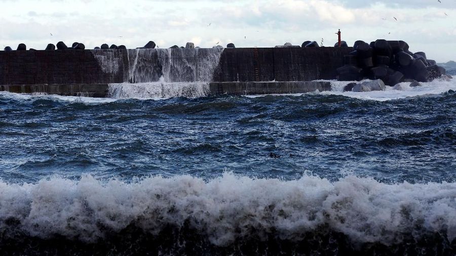 A high wave hits a seawall in Tanohata village, Iwate Prefecture, Japan, March 1, 2018. REUTERS/Kim Kyung-Hoon SEARCH