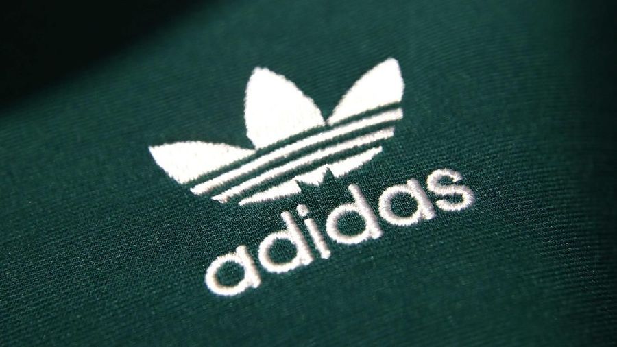 An Adidas sign is seen before the company's annual news conference in Herzogenaurach, Germany March 14, 2018. REUTERS/Michael Dalder