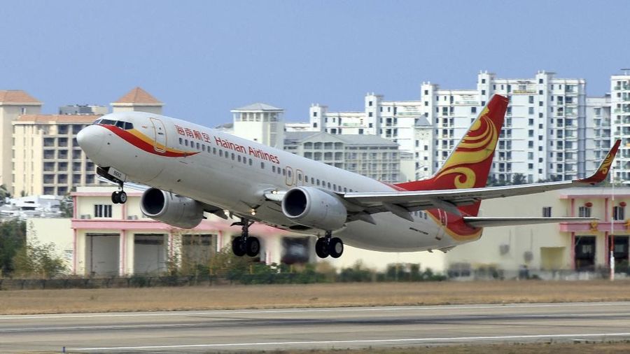 FILE PHOTO: A Hainan Airlines plane takes off from the Sanya Phoenix International Airport in Sanya, Hainan province, China, May 1, 2015. REUTERS/Stringer/File Photo CHINA OUT. NO COMMERCIAL OR EDITORIAL SALES IN CHINA