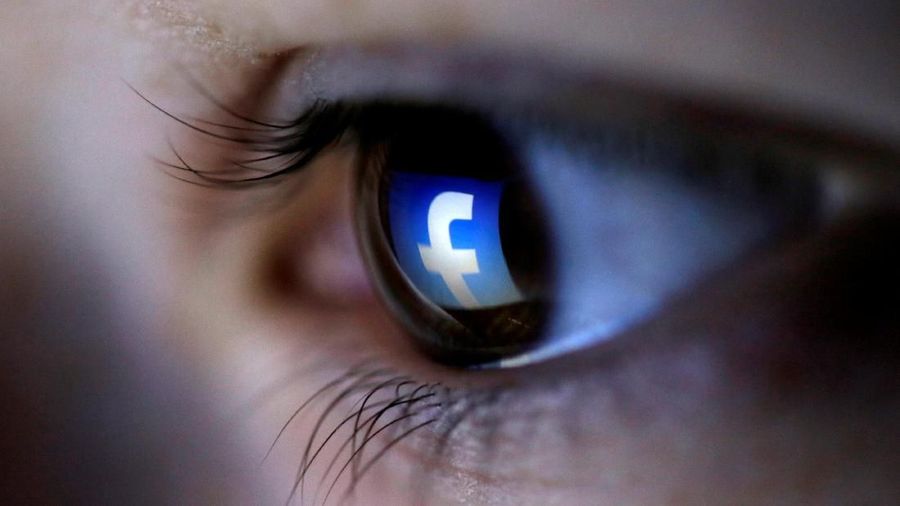 FILE PHOTO: A picture illustration shows a Facebook logo reflected in a person's eye, in Zenica, March 13, 2015. REUTERS/Dado Ruvic/Illustration/File Photo