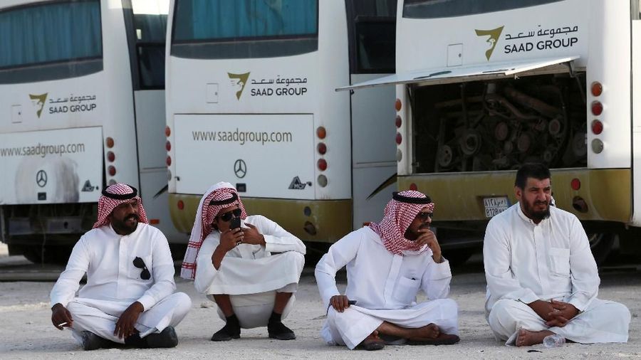 People sit during an auction for vehicles and other possessions belonging to billionaire Maan al-Sanea and his company in Dammam, Saudi Arabia March 18, 2018. Picture taken March 18, 2018. REUTERS/Zuhair Al-Traifi