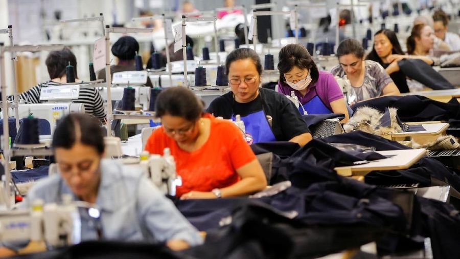 Workers make jackets at the Canada Goose factory in Toronto, Ontario, Canada, February 23, 2018. REUTERS/Mark Blinch