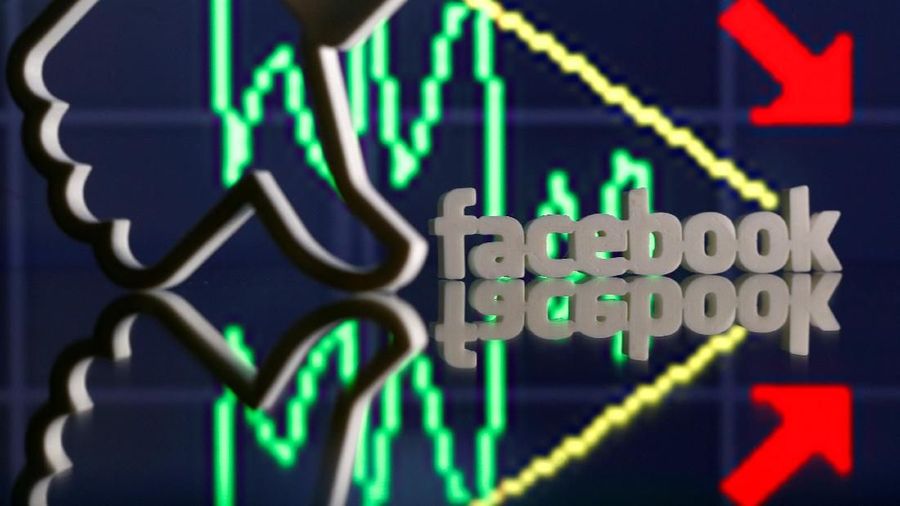 A 3D-printed Facebook logo and Like are seen in front of displayed stock graph in this illustration photo, March 20, 2018. Picture taken March 20. REUTERS/Dado Ruvic