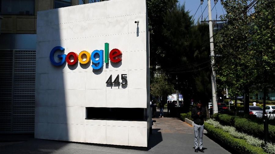 A man checks his phone outside the Google headquarters in Mexico City, Mexico March 13, 2018. REUTERS/Tomas Bravo