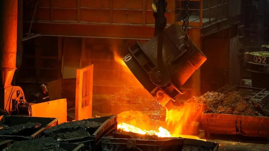 A worker looks at a molten ferroalloy ladle at Eurasian Resources Group's (ERG) Aksu Ferroalloys Plant in the town of Aksu, north-eastern Kazakhstan, February 19, 2018. REUTERS/Shamil Zhumatov     SEARCH 